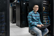 © Maa Hoo/Stocksy - Portrait of engineer working in data center