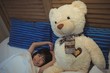 © wavebreak3 - Girl yawning while sleeping in bedroom