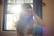 © wavebreak3 - Girl waking up and rubbing her eyes in bedroom