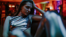 Close Up Of An Attractive Woman In The Bar At Night