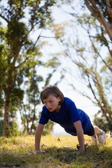 Wall Mural - girl exercising during obstacle course training