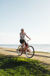 © Rob and Julia Campbell/Stocksy - Vibrant mature woman enjoying herself on a bicycle