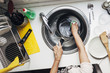 © BONNINSTUDIO/Stocksy - Woman washing dishes