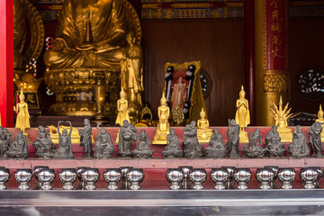 The Golden Buddha Chinese style at Wat Borom Raja Kanjanapisek Wat Leng Nei Yee 2 Temple, People go to temple to pray for good luck and success in life.