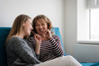 © Martinan - Teenage daughter with mother eating chocolate