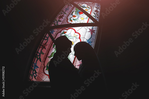 Fotografie, Obraz Muslim couple in a mosque stained glass, Islamic religious wedding ceremony - nikah