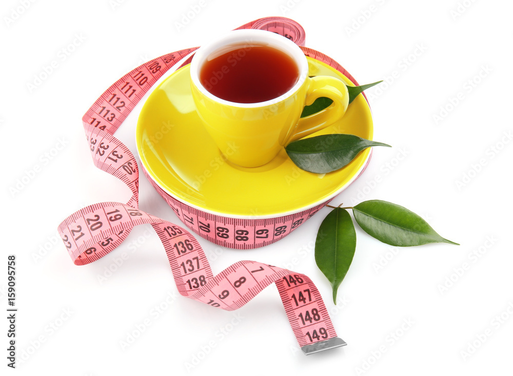 Weight loss concept. Cup of tea and measuring tape isolated on white