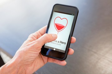 Poster - Composite image of become a hero text with heart shape on screen