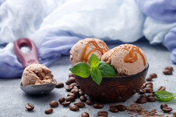 Wall Mural - Homemade coffee ice cream with caramel and mint. Selective focus