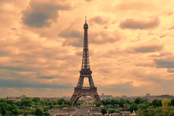 Wall Mural - Eiffel Tower in Paris at sunset with cumulus clouds. Tour Eiffel at sunset. 