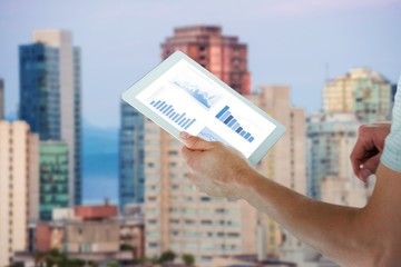 Poster - Composite image of man holding digital tablet