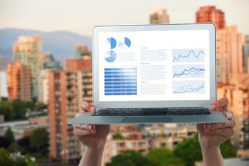 Poster - Composite image of cropped hands holding laptop