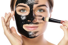 Beautiful Woman Is Applying Purifying Black Mask On Her Face