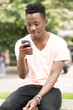 © antgor - African american man using his cell phone