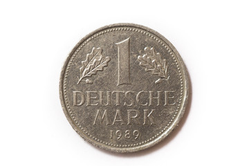 Frontal view of the obverse (heads) side of a a 1 Deutsche Mark (DM) coin minted in 1989. Depicted is the denomination of the coin between Oak leaves. Isolated on white background.