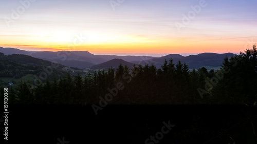 French countryside - Vosges. Sunrise in the Vosges with a view of the Rhine valley and the Black Forest (Germany) in the background. © PhotoGranary
