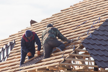 workers working on the roof