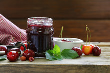 Organic Cherry Jam With Fresh Berries On The Table