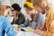 © wayhome.studio  - Youth, education and friendship concept. Group of clever creativ students sitting together in canteen surrounded with books and notebooks drinking coffee having concentrated and serious look