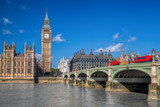 Fototapeta Big Ben - London with red buses against Big Ben in England, UK