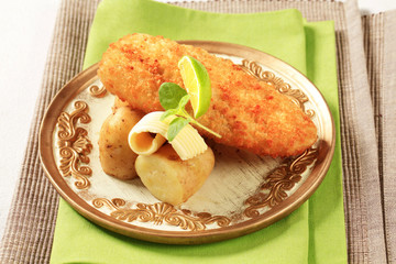 Canvas Print - Fried fish fillet with new potatoes