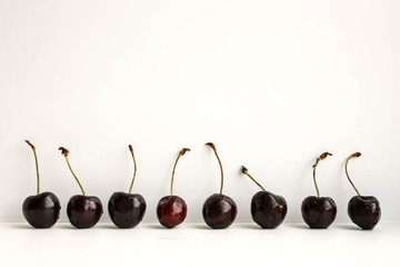 Cherry dark stand near the wall in a row