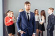 © alfa27 - Image of business leader looking at camera in working environment