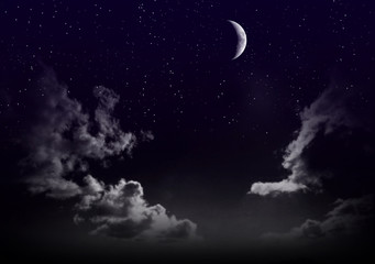 beautiful magic blue sky with clouds and moon and stars at night closeup
