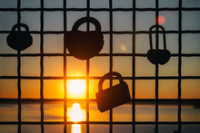 Locks For Happiness Hanging On The Sunset Background