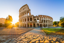 Colosseum At Sunrise, Rome, Italy, Europe. Rome Ancient Arena Of Gladiator Fights. Rome Colosseum Is The Best Known Landmark Of Rome And Italy