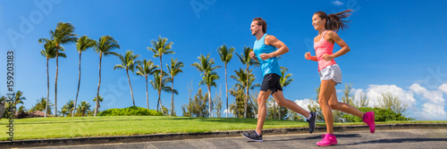 Fotografía Sport runners running on summer park road banner - couple of young people jogging training cardio together - horizontal crop for landscape copyspace