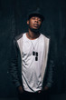 © Photodrive - Dangerous drug addict black man stay on dark background. American gangster, dangerous people, urban style concept