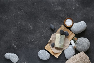 Composition of spa treatment on dark table Top view