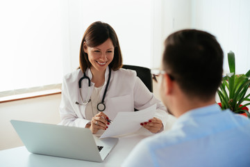 female doctor talking to patient