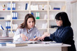 © Elnur - Young student and teacher during tutoring lesson