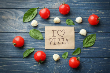 Wall Mural - Pizza ingredients  on wooden background. I love pizza concept