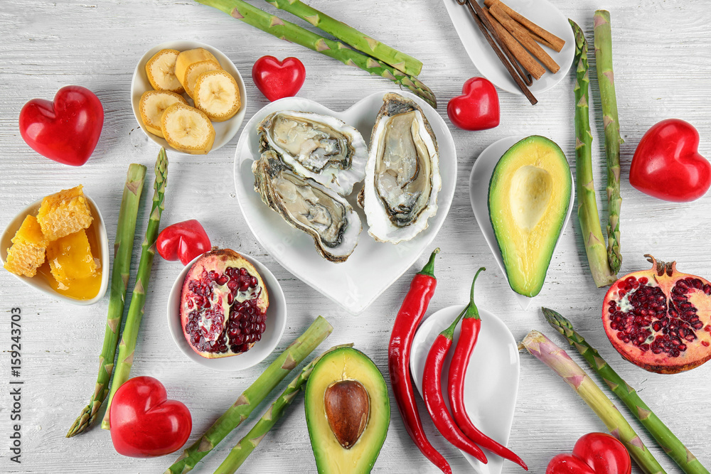 Different aphrodisiac food for increasing sexual desire on wooden table
