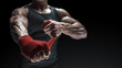 Close-up photo of strong man wrap hands on black background with copy space for text