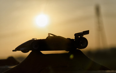 Historic single-seater with sunset in background