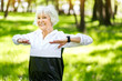© Yakobchuk Olena - Happy senior woman training outside in park