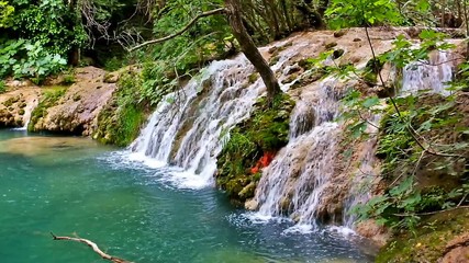 Sticker - The streams of Kursunlu waterfall drop to the deep canyon among the lush greenery of the forest, Antalya, Turkey.
