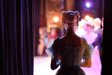 Fototapeta  - A ballerina awaiting the moment of entering the stage in the play