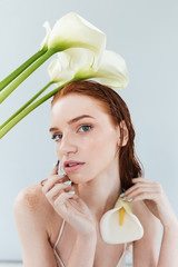 Poster - Close up portrait of a beautiful redheaded woman posing