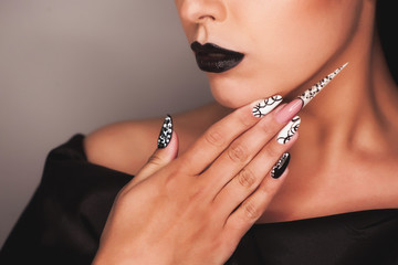 Creative nail design in black and white tones