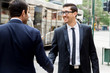 © Sergey Nivens - Two businessmen shaking their hands