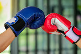 Fototapeta  - Red and Blue boxing gloves in Gym Fitness