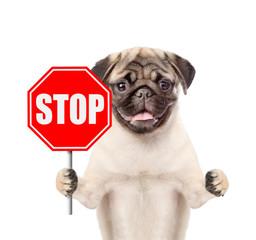 Poster - Dog holding stop sign. Isolated on white background