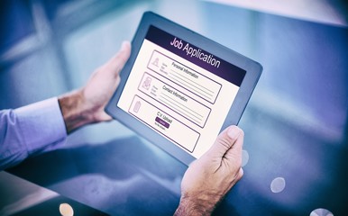 Poster - Composite image of businessman using his tablet 