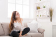 © Prostock-studio - Girl at home chatting on mobile