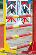 Multi colored wooden barriers on the ground for jumping horses and riders